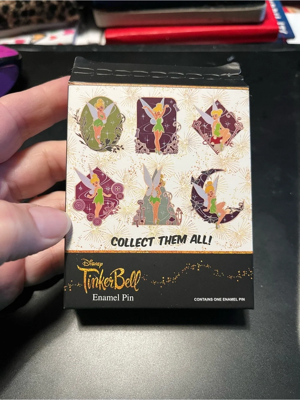 Disney Tinker Bell Pin, mushrooms and keys on brown background